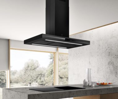 Modern ceiling-mounted black kitchen hood in a minimalist kitchen.