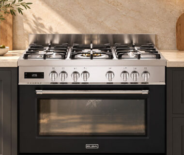 ELBA stainless steel freestanding gas stove with multiple burners and a spacious oven in a modern kitchen.
